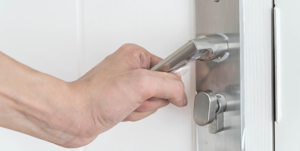 person-opening-door-via-handle